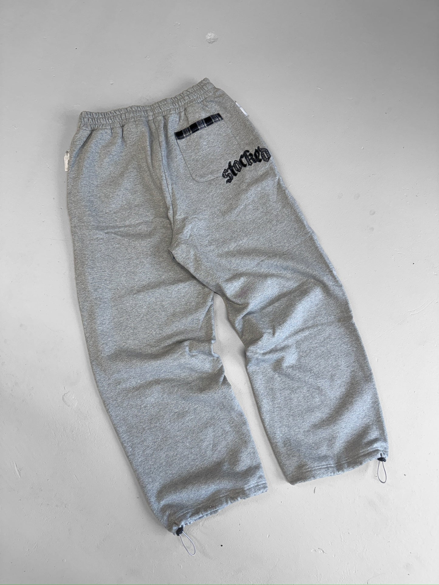 STOCKED PLAID JOGGERS